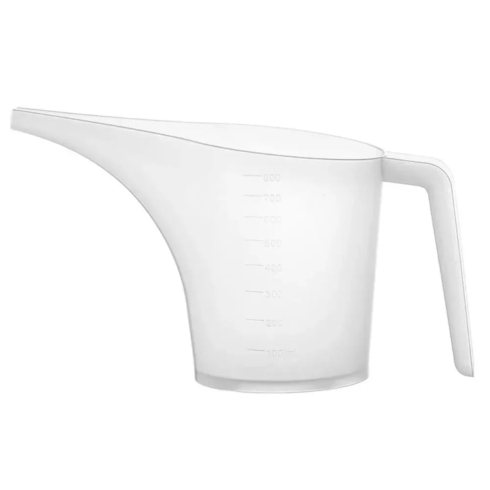 A white plastic measuring cup with volume markings and a long spout.