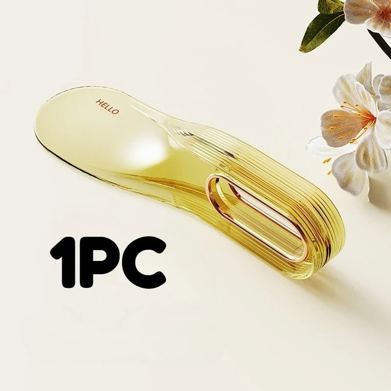 A clear yellow mattress lifter wedge tool is shown on a light background.