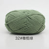 A ball of soft 4-ply milk cotton yarn used for knitting and crochet.