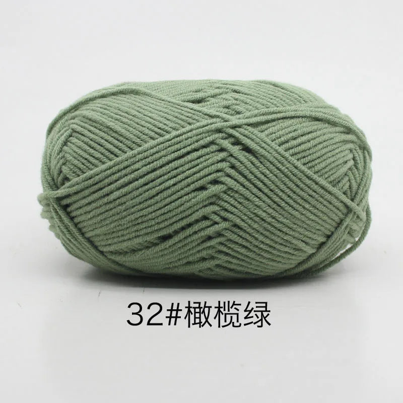A ball of soft 4-ply milk cotton yarn used for knitting and crochet.