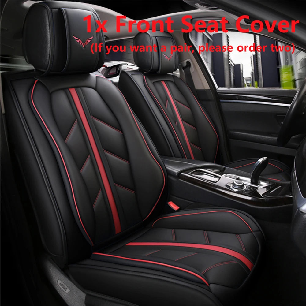 A set of black car seat covers with red stitching shown inside a vehicle cabin.