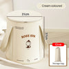 Cream-coloured foldable foot bath basin with lid and storage bag shown on a light surface.