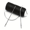 A spool of black nylon hair weaving thread with a needle for extensions and wigs.