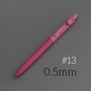 A pink Uni ZENTO quick-dry gel pen with a silver tip, shown diagonally on a gray background.