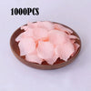 A pile of 1000 pink silk rose petals for weddings and proposals.