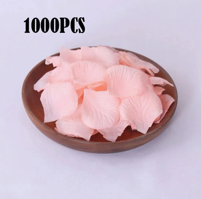 A pile of 1000 pink silk rose petals for weddings and proposals.