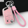 A pink TPU car key fob cover with a metal keyring and braided strap.