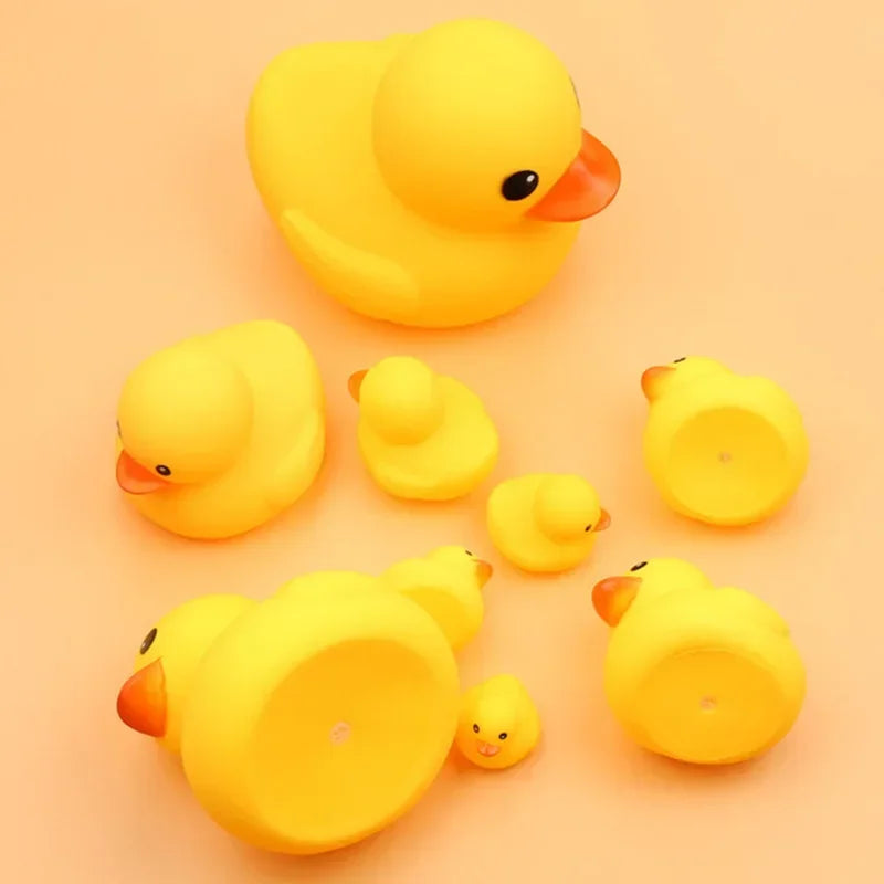 A bright yellow rubber duck toy with an orange beak and eye, shown from above.