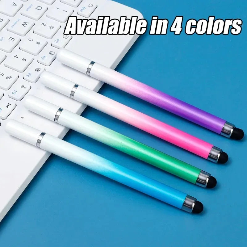 Four colored stylus pens displayed next to a white laptop keyboard.