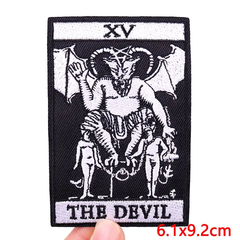 Black embroidered patch featuring a stylized devil with horns and a skull design