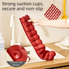 Roter Silikon-Spülschutzabfluss mit Saugnapf-Design in einer Küchenspüle in Gebrauch.