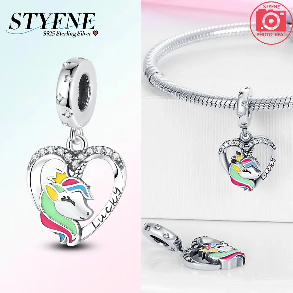 Silver pendant featuring a unicorn and pegasus design with rainbow colors and sparkling crystals