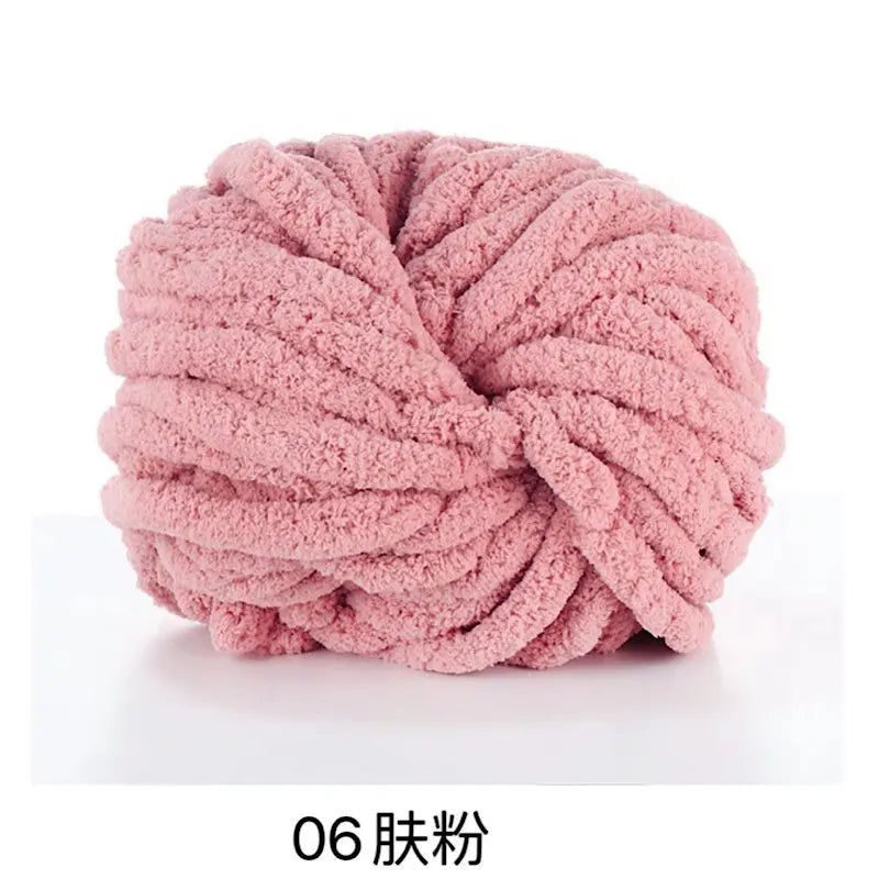 A ball of pink chunky chenille yarn used for knitting and crochet