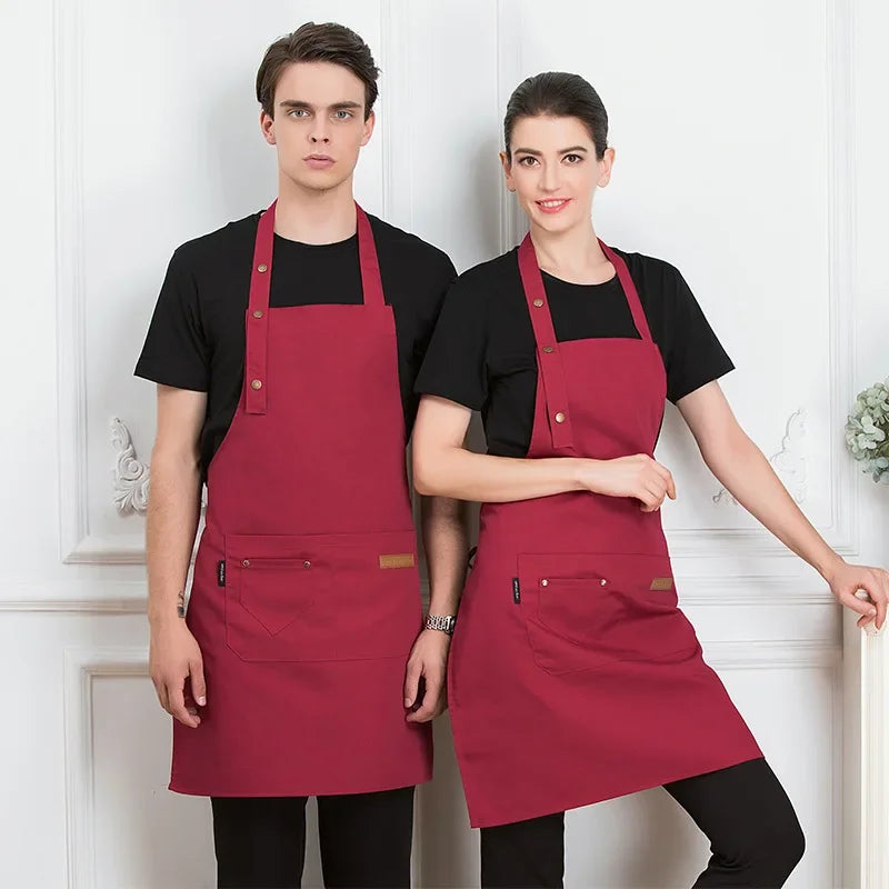 A man and a woman model an adjustable red apron for kitchen or work use.