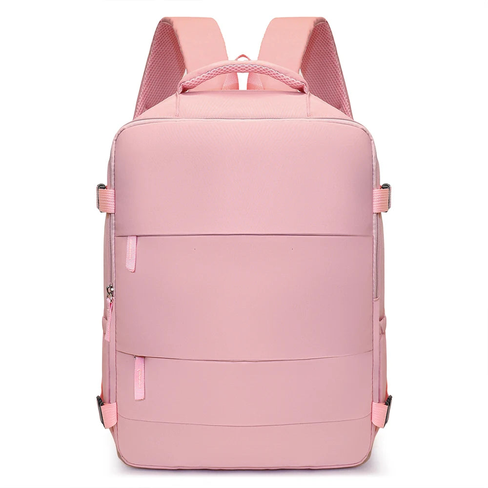 A pink compact cabin travel backpack with pink straps and multiple horizontal compression straps.