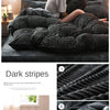 Dark striped reversible corduroy duvet cover set featuring a velvet finish in charcoal gray.