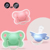 Silicone baby pacifiers in pink and green colors shown with a protective cover.