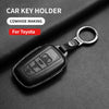 Black leather car key holder for Toyota models with a metal ring and key fob.
