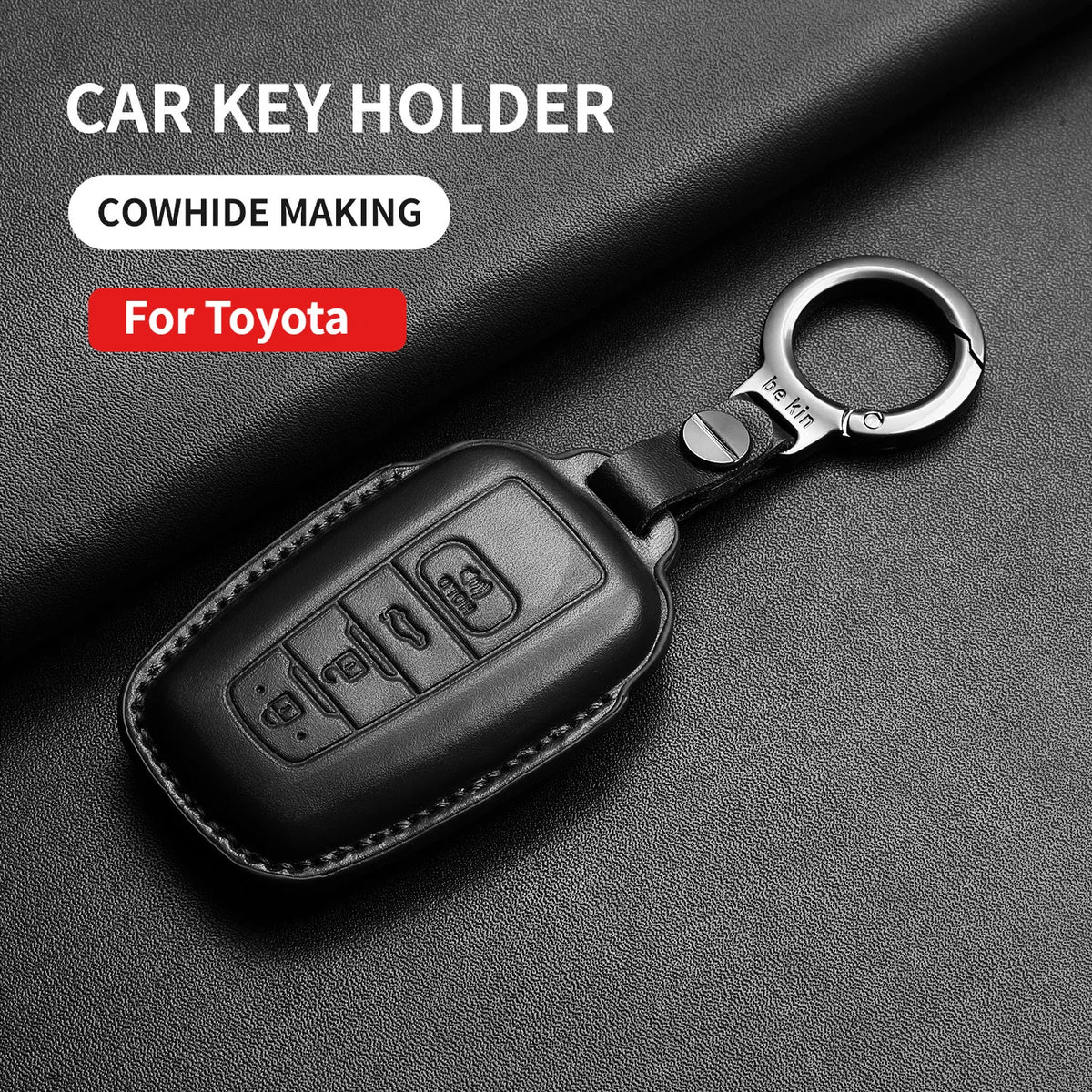 Black leather car key holder for Toyota models with a metal ring and key fob.