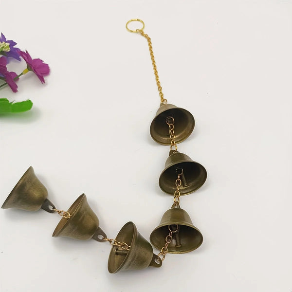 A classic metal wind chime with a decorative gold chain and multiple bronze-colored bells.