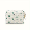 A cream-colored fabric diaper caddy organizer with a white background featuring a repeating pattern of green pine trees and s