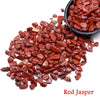 A pile of reddish-brown tumbled jasper crystal stone chips.
