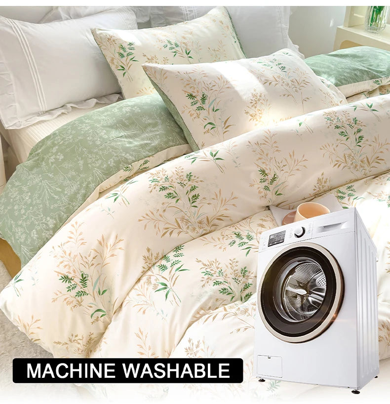 A white floral tea art print duvet cover set displayed on a bed with a washing machine nearby.