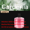 A pink bottle of Gardenia essential oil with a label instructing to refill liquid only diffuser machine not included.