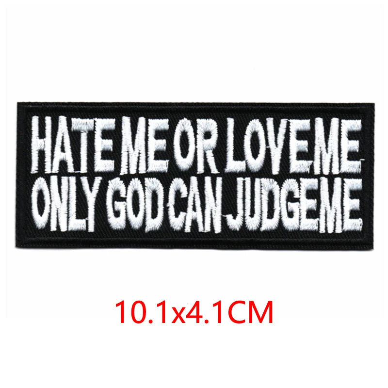 Black embroidered iron-on letter patch with white text that reads Hate Me or Love Me Only God Can Judge Me