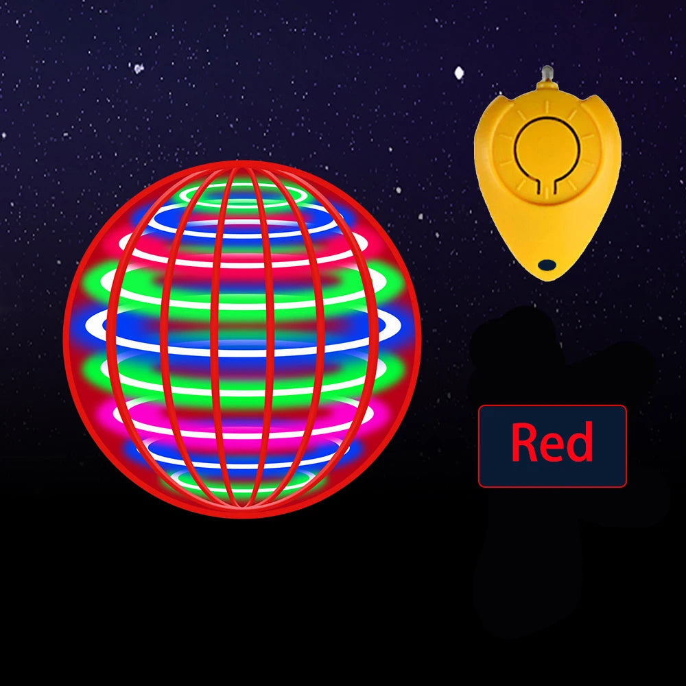 A red sphere glowing with multiple colored LED lights next to a yellow remote control.