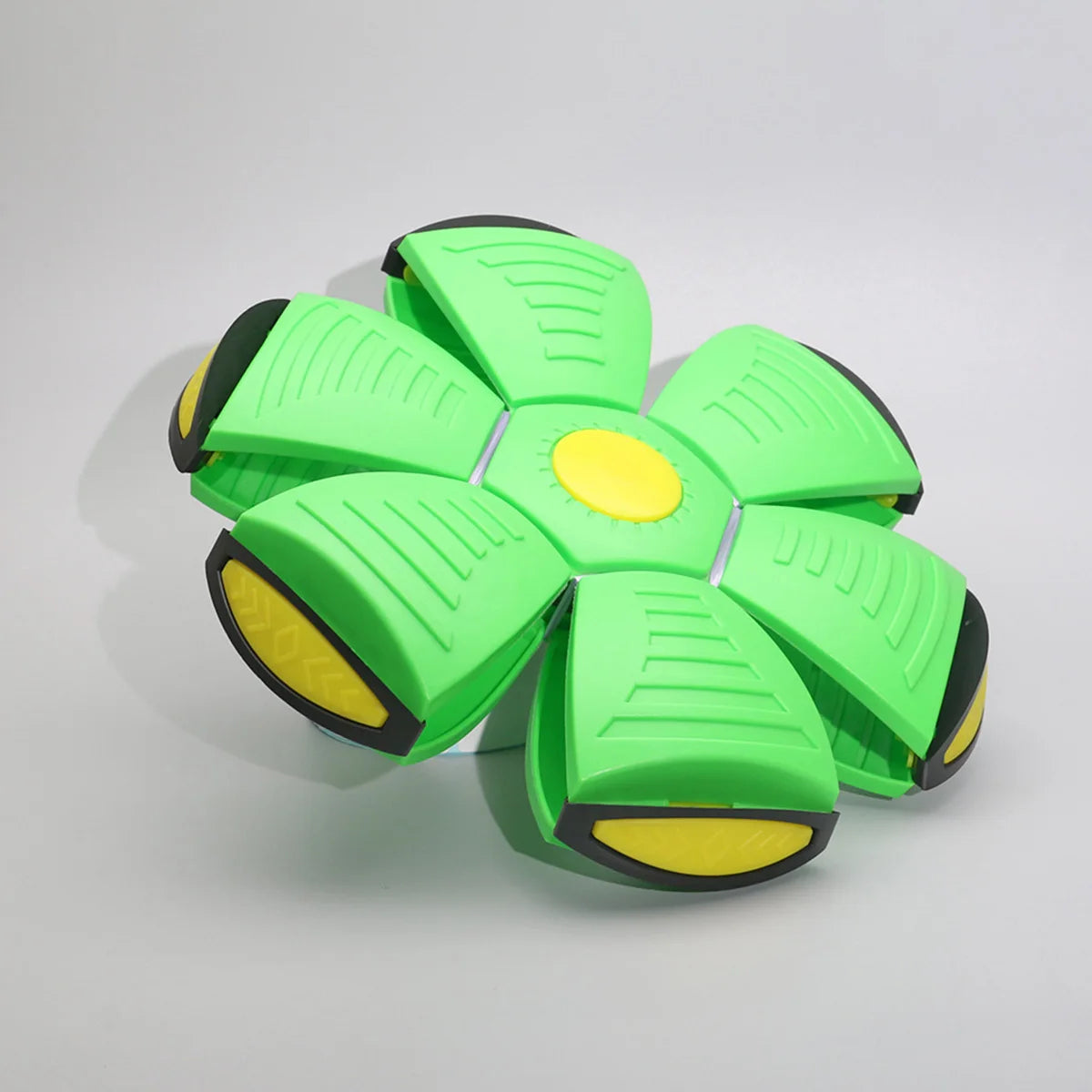 A bright lime green magic flying saucer bouncing ball designed for dogs and kids.