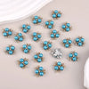 A collection of blue and silver pearlized resin flower beads for DIY jewelry and crafts.