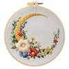 DIY embroidery kit featuring a golden butterfly and silver moon design on a round canvas.