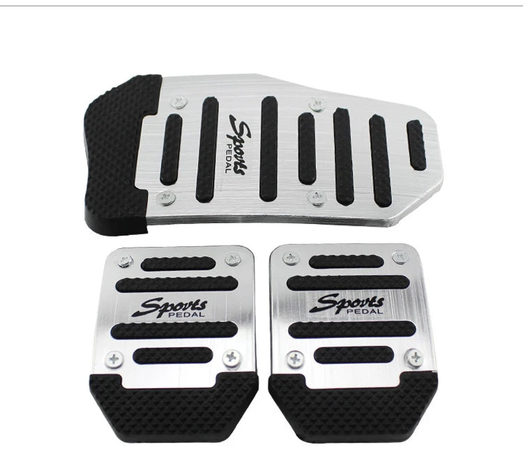 A set of silver and black sports pedal covers for a car pedal.