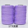 Two spools of purple 3-ply polyester knitting yarn for crochet and hand crafts