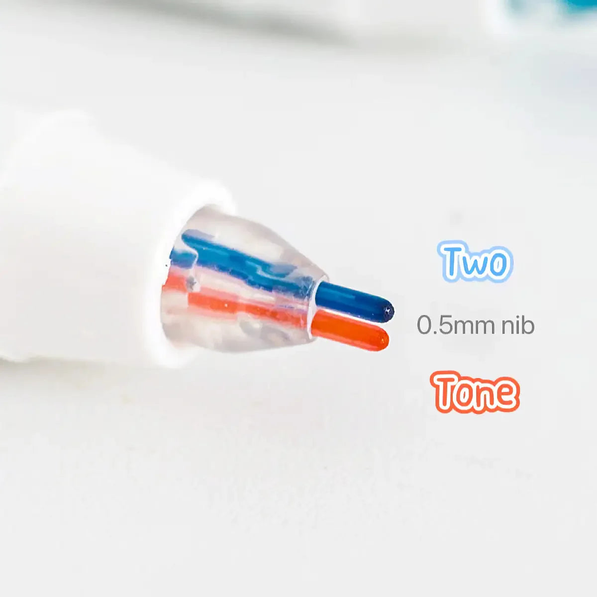 Close-up view of a white marker pen with two colored tips, labeled Two and Tone.