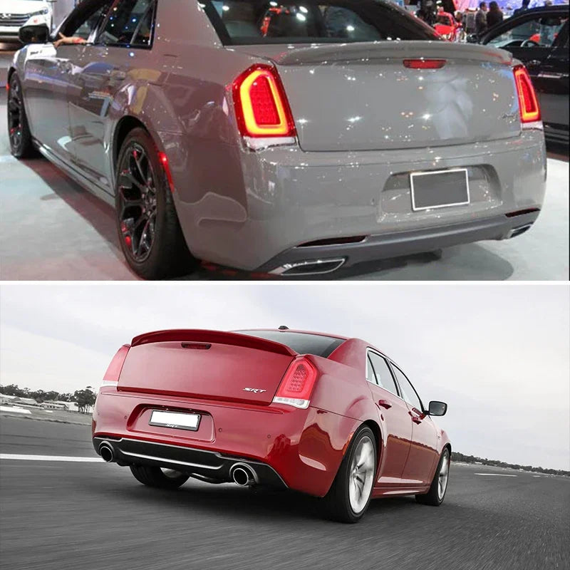 A red Chrysler 300 is driving on a road, showing the rear bumper reflector light covers.