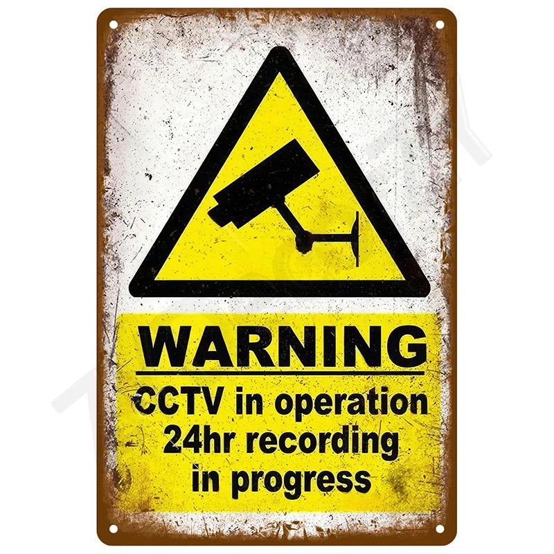 A vintage metal tin sign with a yellow warning triangle indicating CCTV in operation and 24hr recording in progress.