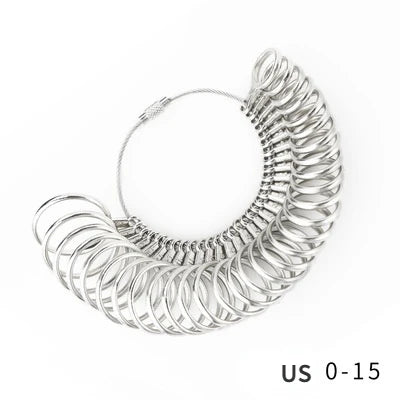 A silver metal ring sizing gauge with multiple conical sizes is shown against a white background.