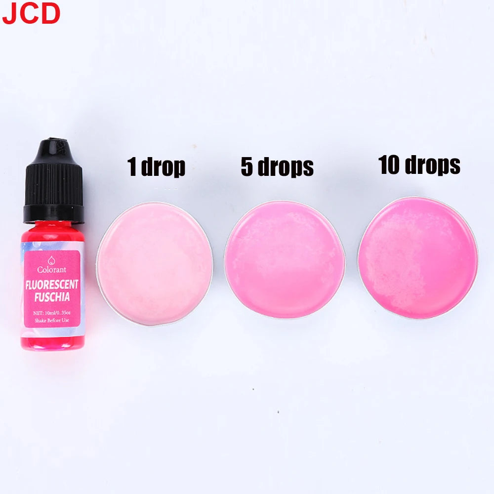 A set of fluorescent pink liquid candle dye in various drop quantities, including 1, 5, and 10 drops.