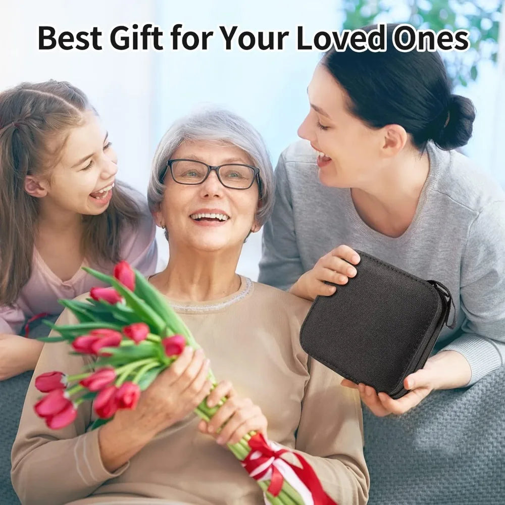 Three women smiling while one presents a dark brown sewing kit to another.