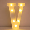 A glowing yellow LED letter night light shaped like the letter V, featuring multiple illuminated dots.