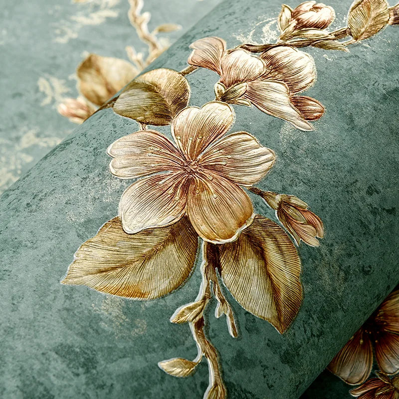 A close-up of a 3D embossed floral self-adhesive wallpaper roll featuring muted gold and olive green tones.