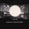 A clear plastic package containing a white, circular compressed cleansing towel.