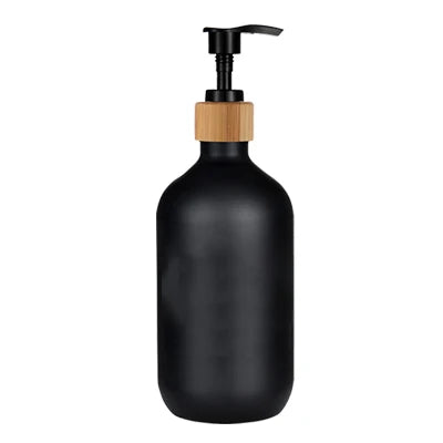 Black refillable soap dispenser bottle with a wooden pump top