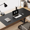 A black laptop displaying the time 8:31 is placed on a dark desk mat in an office setting.
