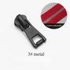 A black metal zipper slider repair kit with a visible stitching detail is shown against a white background.