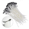 A bundle of 53 natural white cotton candle wicks with metal stands arranged diagonally.