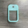 A translucent mint green silicone protective case for a hand sanitizer spray with a keyring.