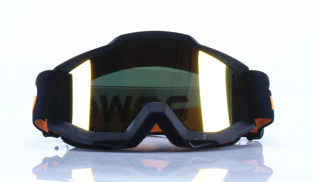 A pair of black retro motorcycle sunglasses with night vision lenses resting on a reflective surface.
